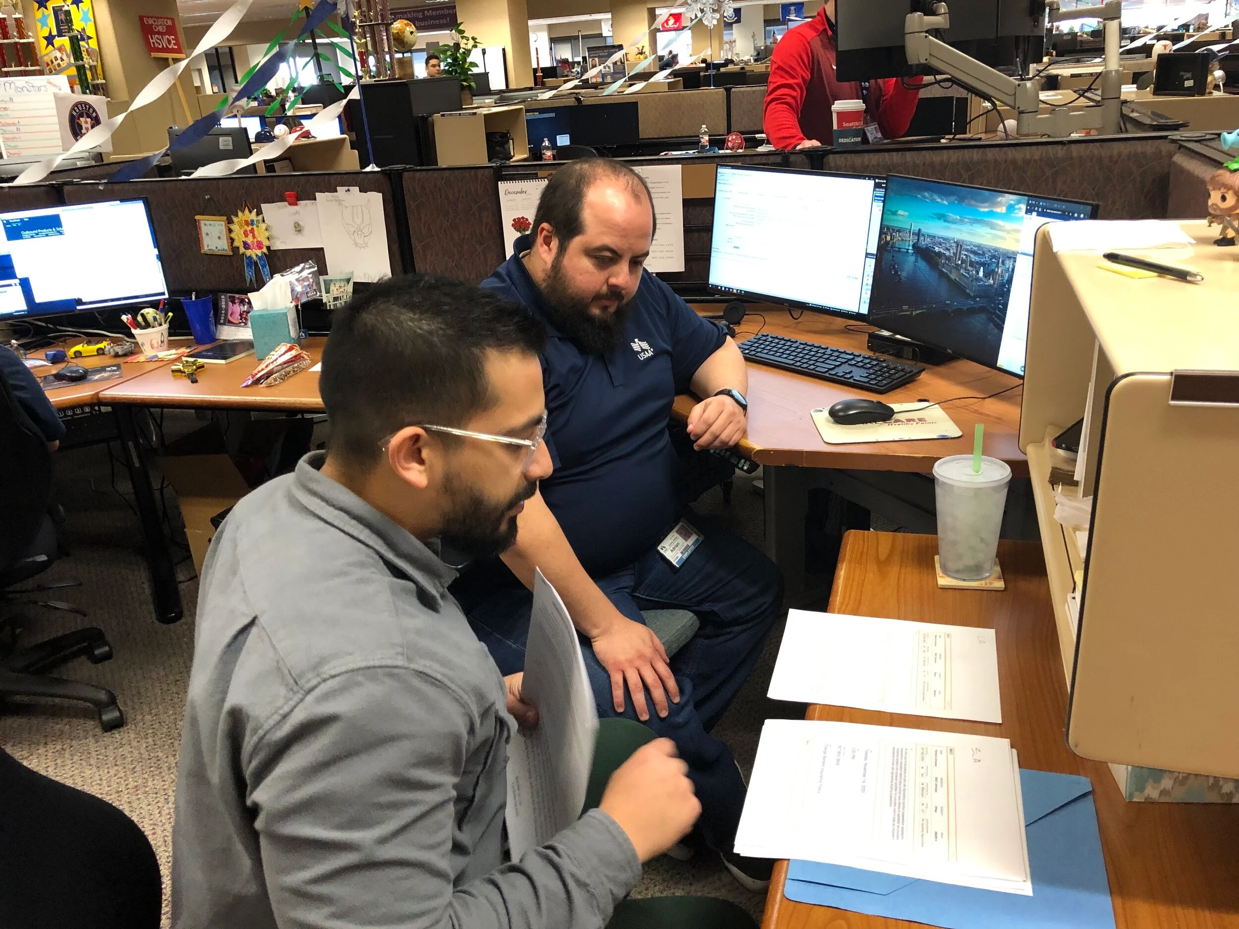 A feedback session: an MSR at their desk talks through the screens